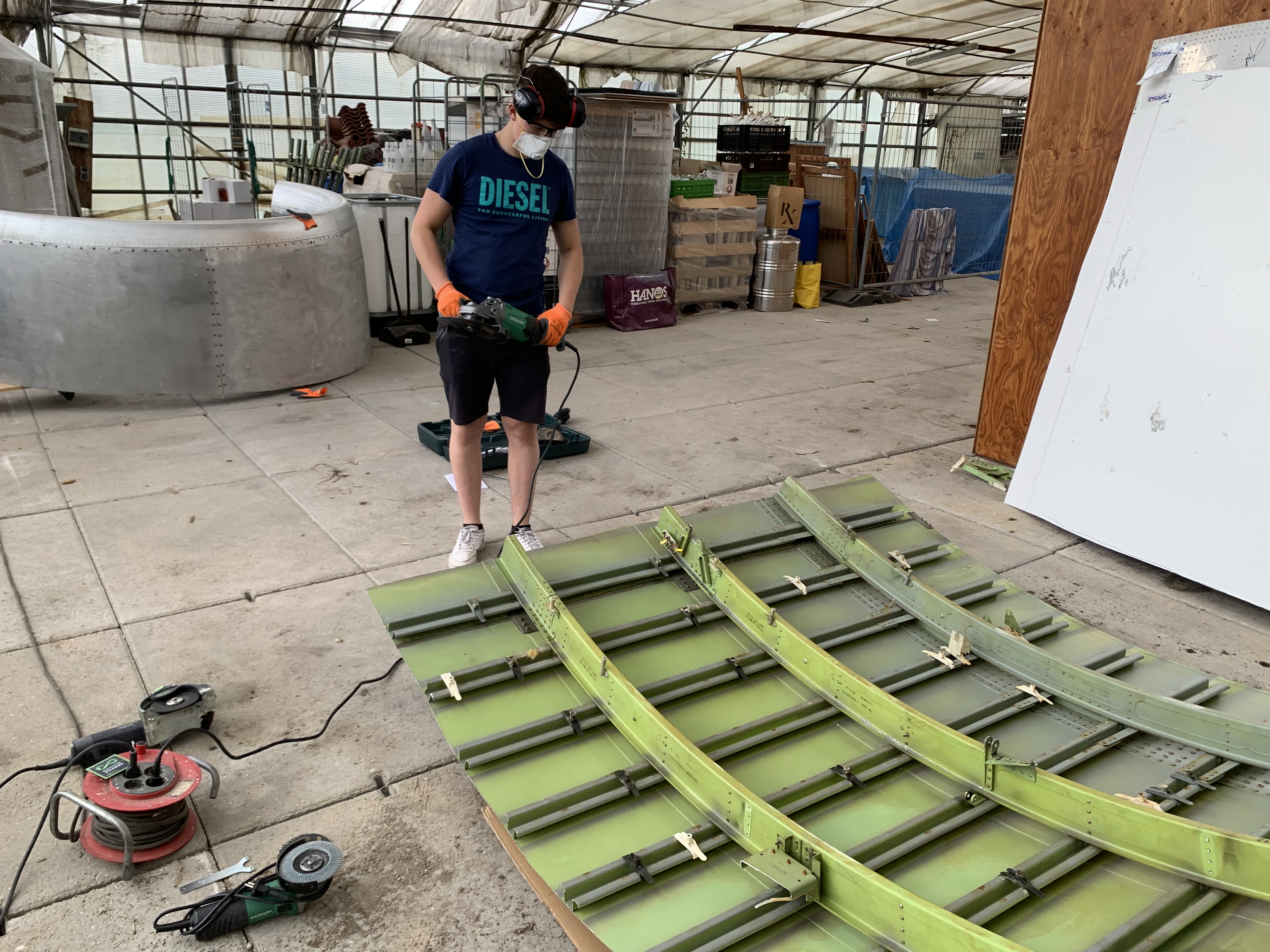 Trimming a curved aircraft section with an angle grinder